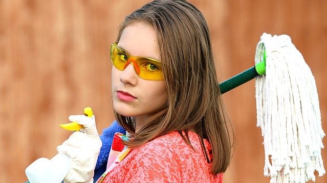 Girl with cleaning supplies