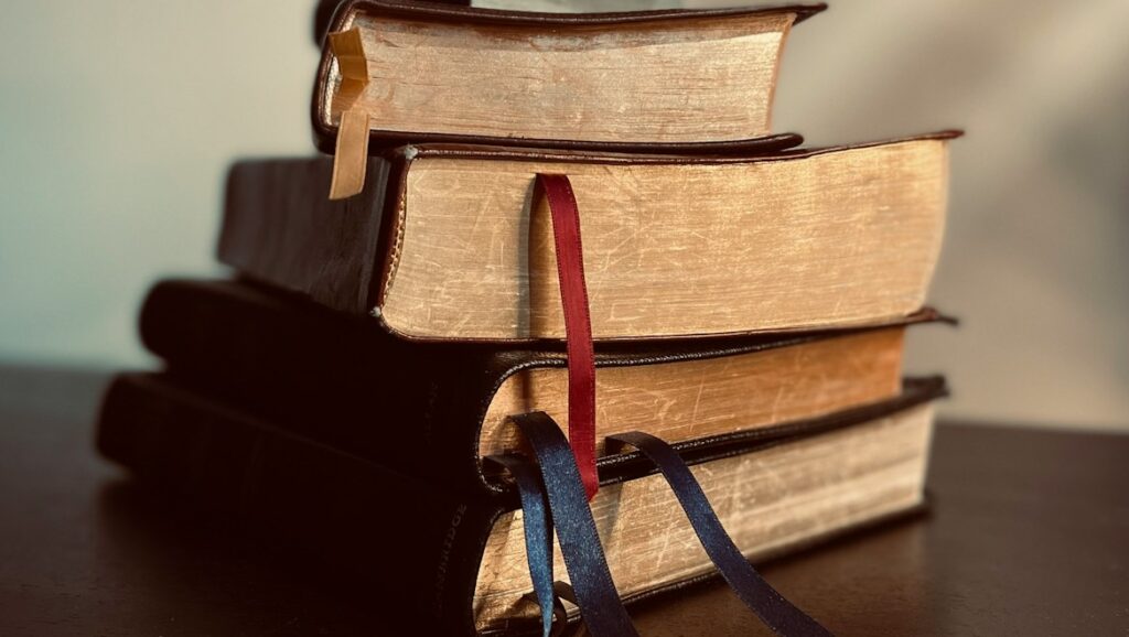 a stack of books sitting on top of a table