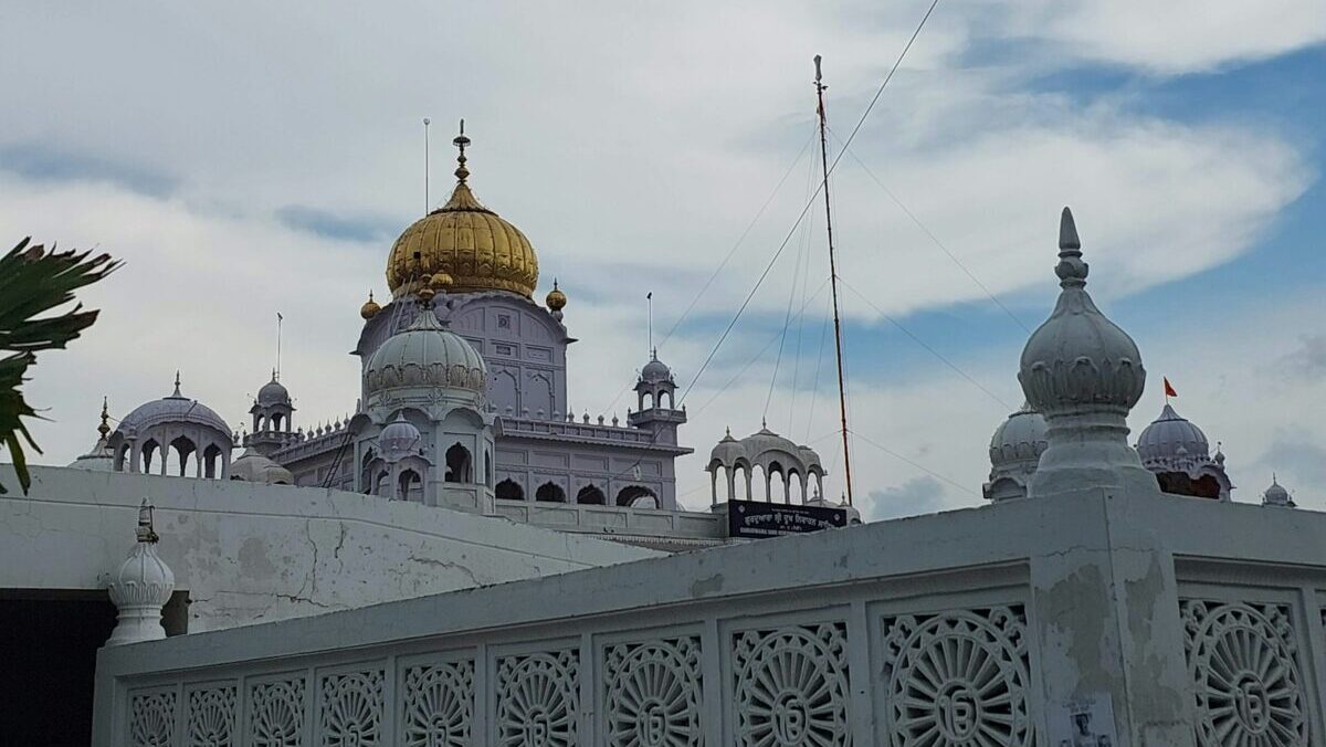 a large white building with a golden dome
