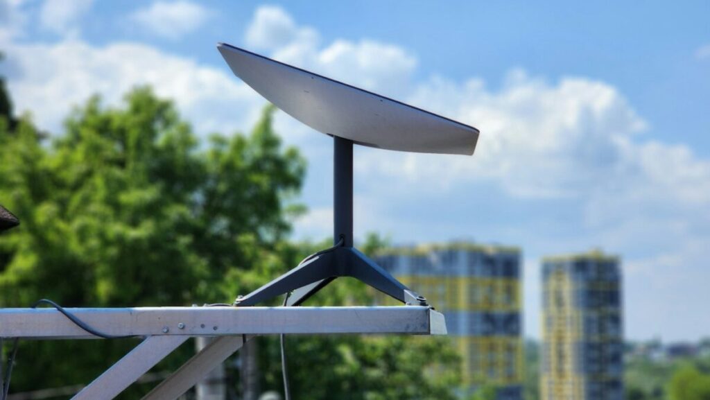 a white surfboard sitting on top of a metal pole