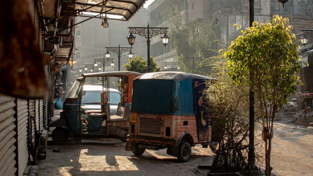 a small truck parked next to a building