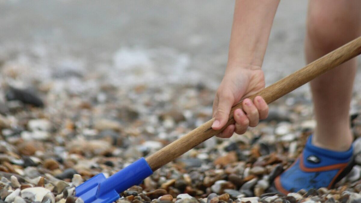 a person holding a stick