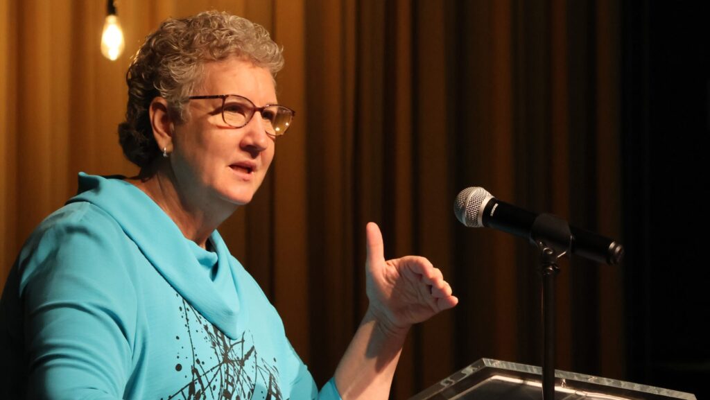 Sandy Wisdom-Martin at podium