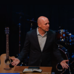 Jed Coppenger encourages students to experience God’s power, presence and provision through prayer