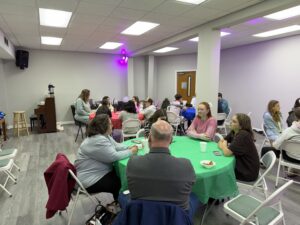 People sitting around tables