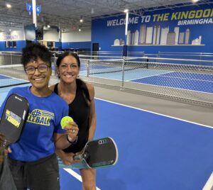 Two women on pickleball court