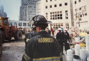 Back of Warrior Fire Department fireman walking around the Ground Zero area